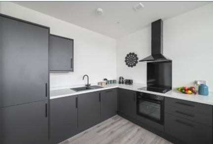 Fitted kitchen with black units