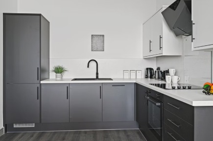 Fitted kitchen with grey units